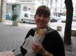 Caroline enjoys a take-away sandwich