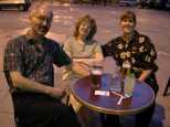 Jim, Mick, and Caroline at a cafe in Grenoble