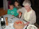 Sarah cuts the cake