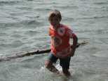 Jeff refloats the logs on the shore