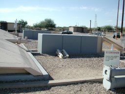 Silo door with bumpers and blocks