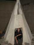 Caroline tries the Tipi in the Interpretive Centre