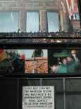 The sign at the checkpoint, and the mural in the background
