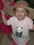 Lucy tries on a hat